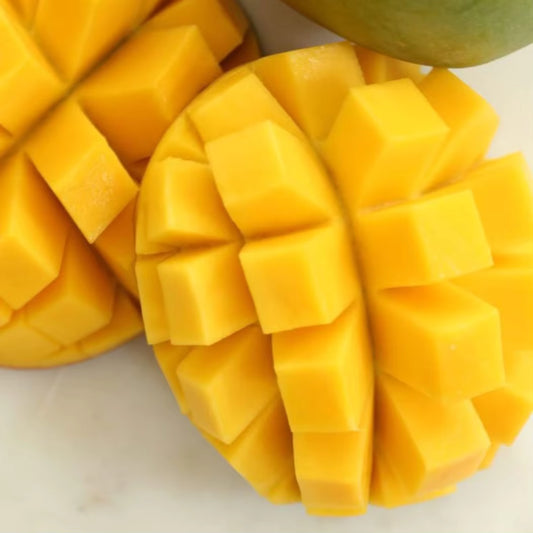 Ripe Mango Cat Chu/Chy (Grafted) fruit cut into cubes, showcasing vibrant yellow-orange flesh for home delivery.