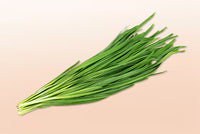 Fresh green Garlic Chives (Pickup Only) bundle with long slender leaves displayed against a soft background
